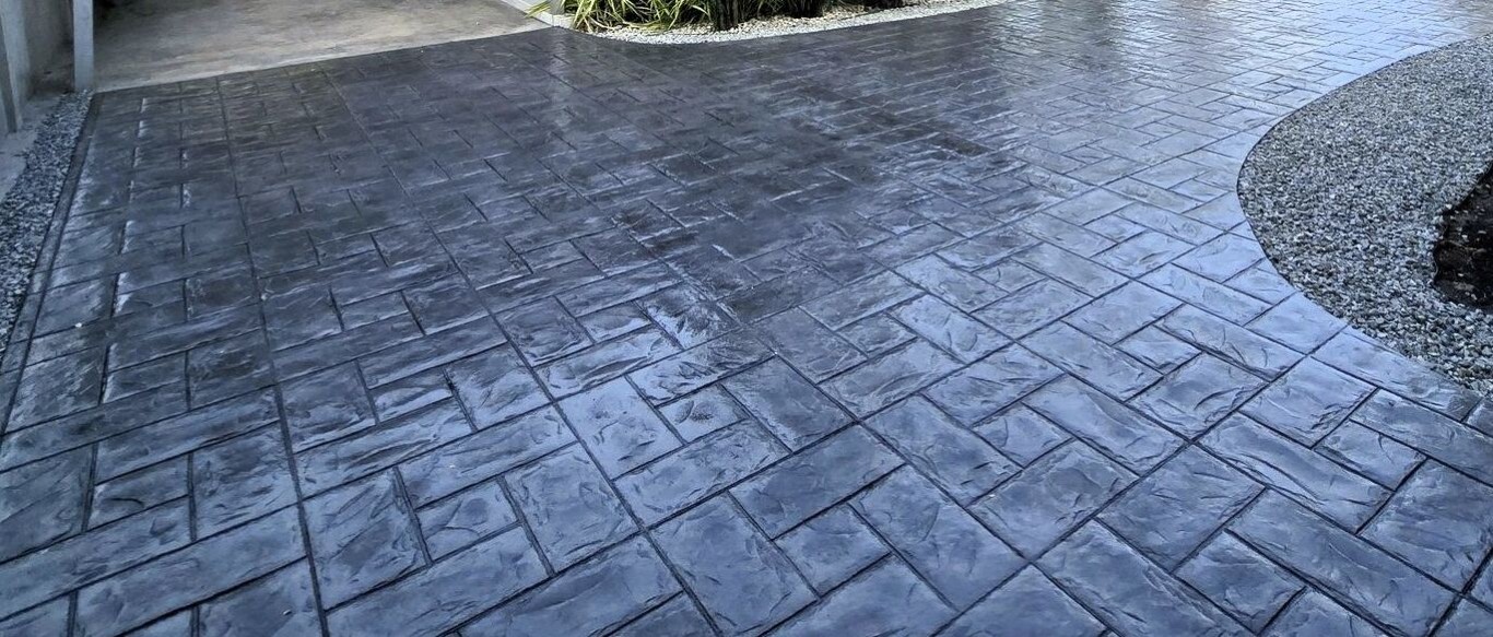 Decorative epoxy garage floor coating with rich finish applied in a Hayward, CA home